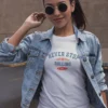 modelo en camiseta blanca con diseño never stop rolling, marca vintage stuff forever