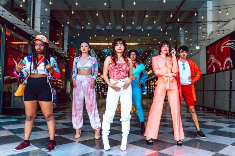 A diverse group showcasing vibrant street fashion and modern style in an urban setting.