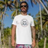 t shirt mockup of a man with surfer shorts standing at the beach 26755